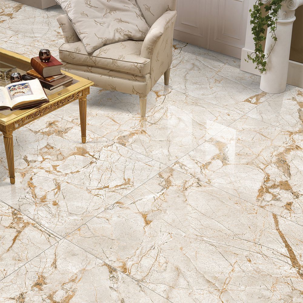 Marble-patterned floor with a beige armchair and coffee table in the background